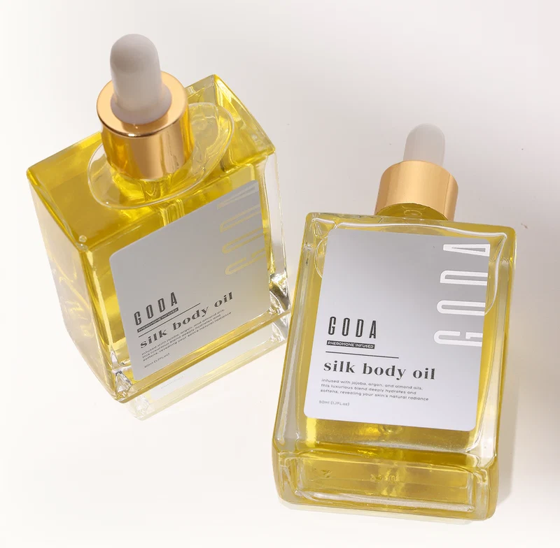 Two GODA body oil bottles — temporary image